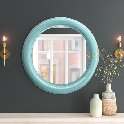 Miroir moderne en métal rond avec cadre en fer élégant et design décoratif contemporain pour un décor élégant.