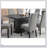 Monette Black Rectangle Dining Table With Layered Pedestal Base, Spacious Top For Elegant And Functional Dining