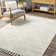 Kerry Textured Geometric Tasseled Area Rug