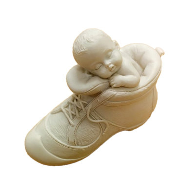 Statue de bébé dans une chaussure Vonville