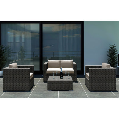 Suffern 4 Piece Rattan Sunbrella Sofa Seating Group with Cushions -  Wade LoganÂ®, 8503D9EE879B476AA51350C8BC6AC0E9