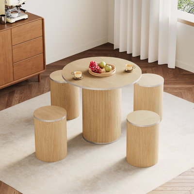Modern 31.5" fluted round dining table a silver outline with 4 round stools