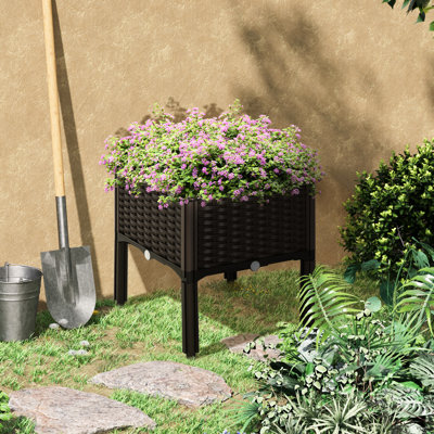 Boîte à fleurs brune surélevée pour jardin