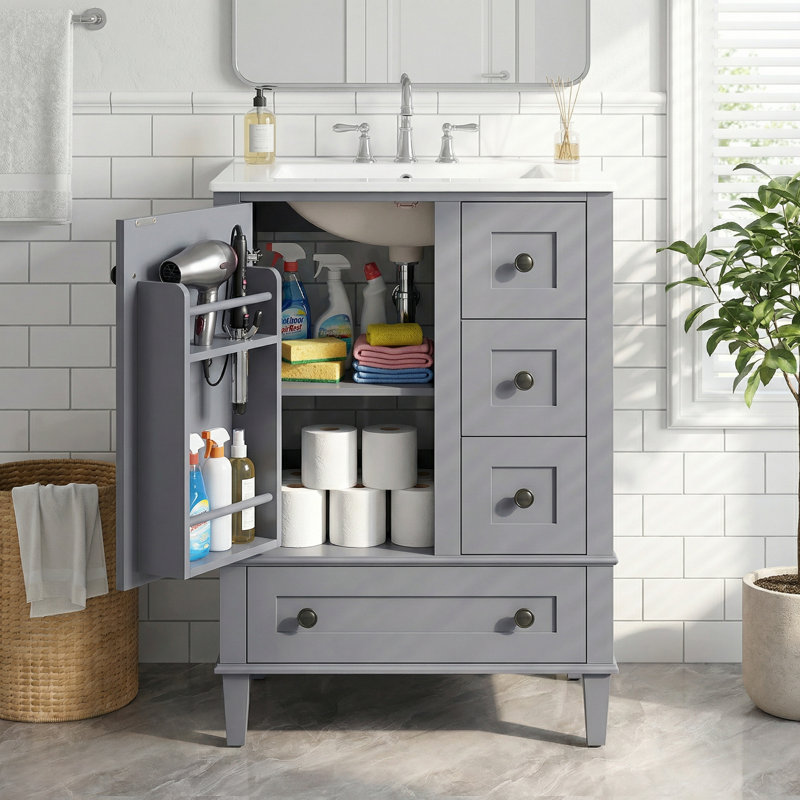 Meuble-lavabo gris de 24 po avec lavabo intégré en céramique et tablette de rangement à deux niveaux derrière le panneau de porte, gris