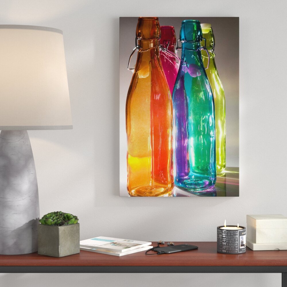 Leinwandbild Bunte Glasflaschen