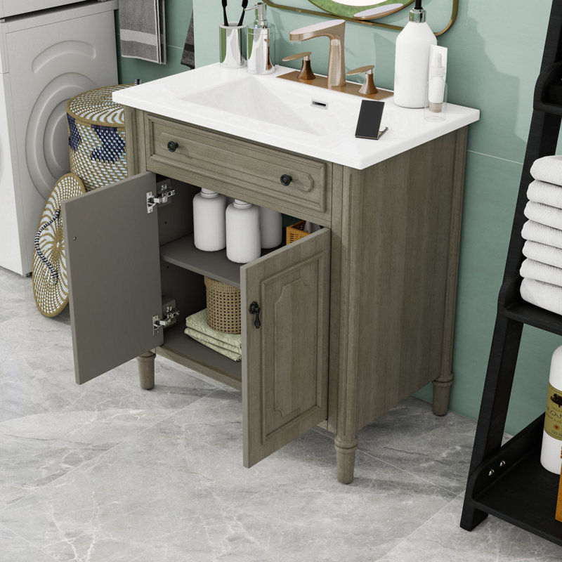 Meuble-lavabo autoportant élégant avec lavabo en céramique brillante, portes à fermeture douce et tablette réglable