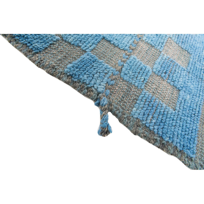 Tapis bleu Kalmanovitz
