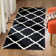 Rodgers Hand Woven Flat Weave Wool/Cotton Geometric Rug in Black/Ivory
