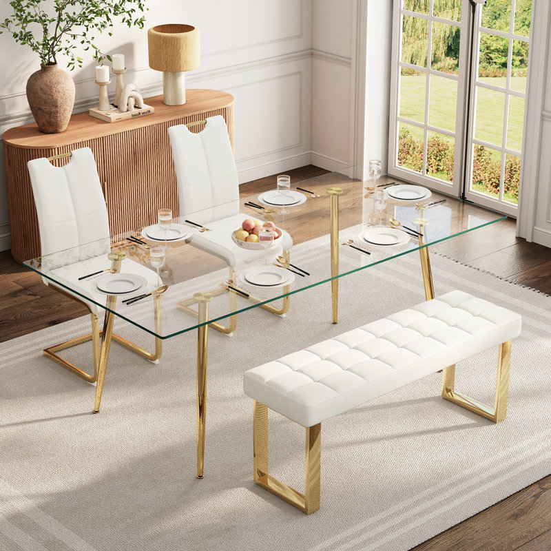 Ensemble de salle à manger en verre pour 4 à 6 personnes, de style moderne, comprenant une table de cuisine rectangulaire en verre, des chaises rembourrées en similicuir et un banc.