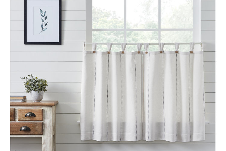 white cafe curtain in a room with white shiplap walls