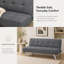 Mobilier gris pliant en tissu à double usage, placé dans le salon, en un clic entre le canapé et le lit