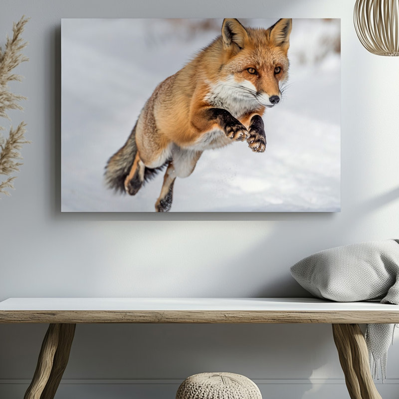 Toile, un renard roux vif au milieu du saut capturé dans un art mural Pose dynamique qui met en valeur son agilité et sa grâce