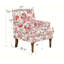 Fauteuil floral avec garniture cloutée, pieds en bois massif et imprimé traditionnel pour un décor campagnard