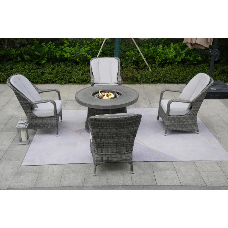 Areefa 4 - Person Patio Dining Set Round Table with Cushions Included