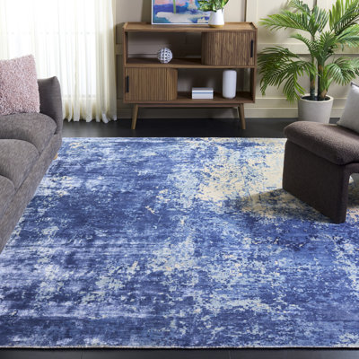 Tapis bleu / blanc à motif abstrait Mcelroy