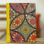 Journal en papier kaléidoscope coloré à la main