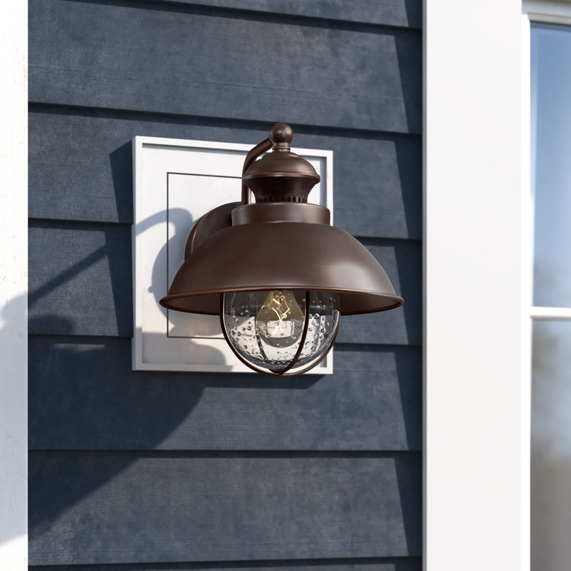 Mohnton 10.25 in. H 1-Light Burnished Bronze Coastal Outdoor Wall Sconce made of Durable Steel, Clear Seeded Glass Shade, LED Compatible, Use for Exterior Porch Patio Front Door or Garage