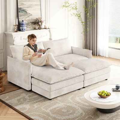 2 fauteuils en velours côtelé pour des moments de détente, repose-pieds amovibles, structure en bois massif, fauteuil inclinable profond, revêtement en tissu, ambiance calme dans le salon, avec 2 poufs, construction, intérieur confortable