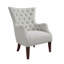 Fauteuil à oreilles capitonné