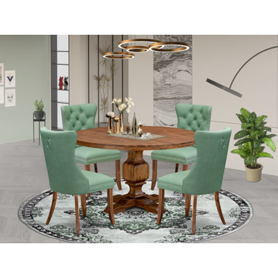 L'ensemble de salle à manger 5 pièces comprend une table ronde et 4 chaises Parson en simili cuir vert saule avec dossier capitonné, noyer antique
