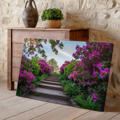 Canvas A Serene Garden Pathway Leads Upward Flanked By Lush Greenery Wall Art And Vibrant Pink Azalea Flowers In Full Bloom Creating A Canvas Wall Art