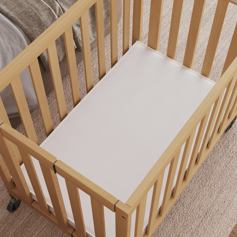 Compact White Foam Crib Mattress with Water Resistant Cover