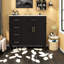 Meuble-lavabo moderne noir avec lavabo en céramique, rangement, accents dorés pour la salle de bain