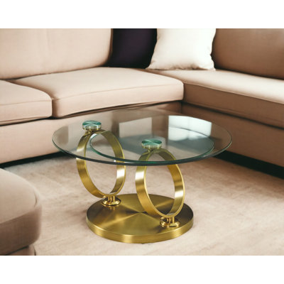 32" Clear And Gold Glass And Metal Round Abstract Coffee Table