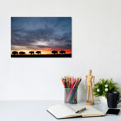 A Silhouette Of A Herd Of Bison And Sunset Near Valentine, Nebraska by Joel Sartore - Gallery-Wrapped Canvas Giclée on Canvas