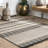 Mukul Geometric Striped Beige/Black Indoor/Outdoor Tasseled Rug-1122638204