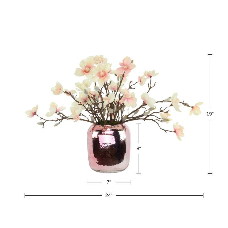 Papillons magnolia dans un vase en verre