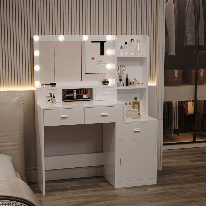 La coiffeuse avec miroir est équipée d'un support pour sèche-cheveux, Blanc