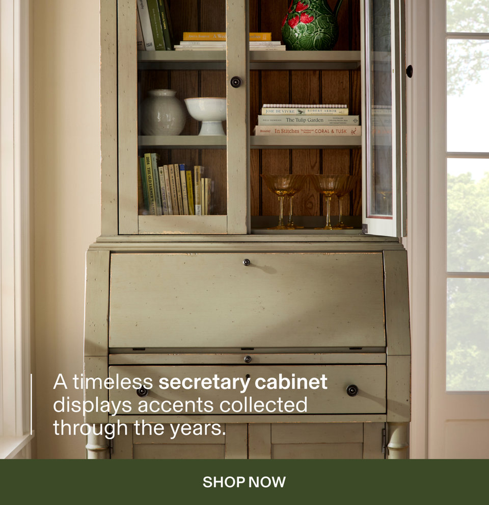A timeless secretary cabinet displays accents collected through the years. Shop Now.
