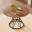 Une table de salle à manger circulaire d'un diamètre de 47,3 pouces, comprenant 4 plateaux de table en MDF grain de bois de noyer, des supports en métal en forme de sablier noir et une table de salle à manger de style industriel moderne pour 4 à 6 personnes.-129417360