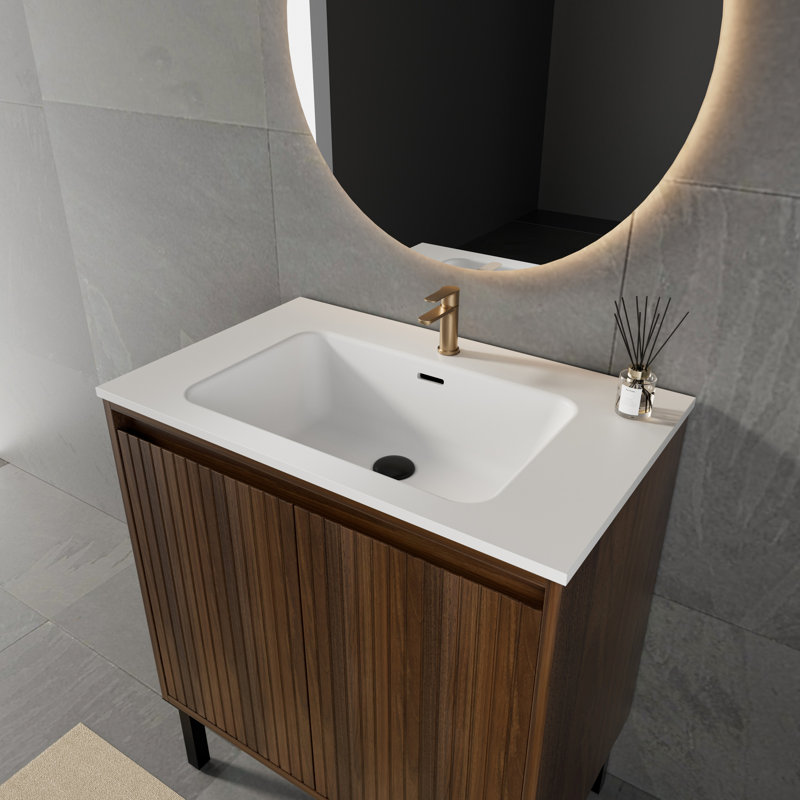 Ensemble de meuble-lavabo simple autoportant avec lavabo en résine à surface solide intégré, portes d'armoire cannelées et pieds en métal