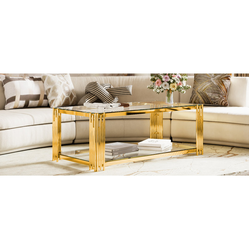Table basse rectangulaire moderne en verre transparent 47,5 "avec finition asymétrique en métal, finition dorée et tablette