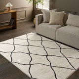 Tapis géométrique beige / noir en polypropylène / polyester tissé à la machine