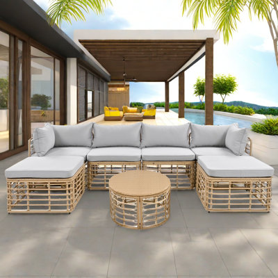 Ensemble de canapé modulaire en rotin pour l'extérieur 7 pièces avec six sièges individuels et une table basse ronde et des oreillers