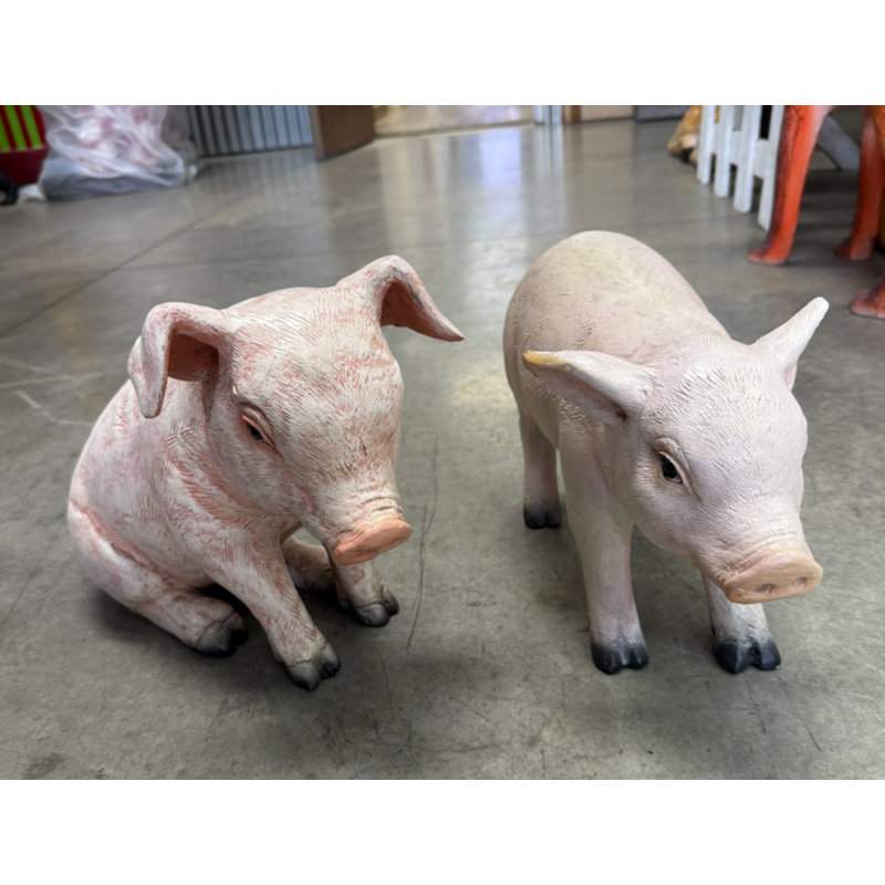 Statue de cochon assis