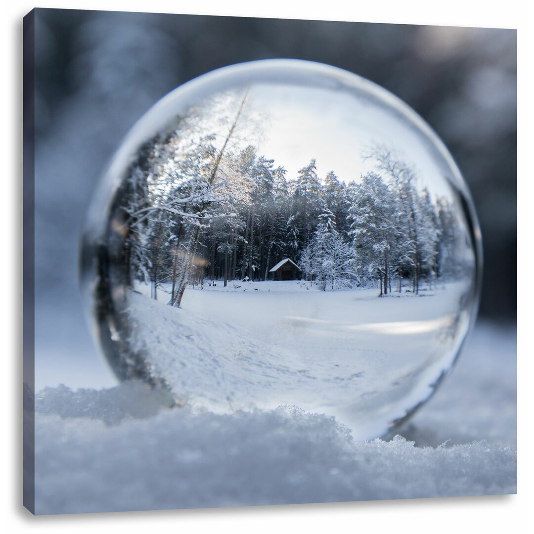 Leinwandbild Eiskugel in Winterlandschaft