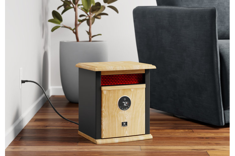 A space heater plugged into the wall and heated to seventy two degrees, placed beside an armchair.