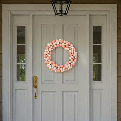 The Holiday Aisle® 18" Artificial Easter Eggs Wreath. Features Easter eggs on a grapevine base.