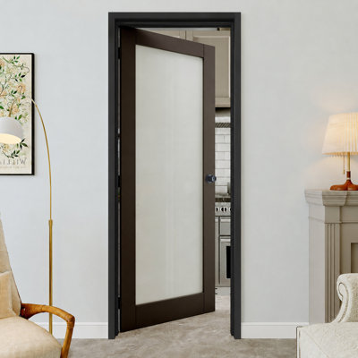Porte prémontée noire à un vantail (71 x 203 cm) avec chambranle noir, vitrage intérieur dépoli, charnières noires, vitrage opaque, âme pleine insonorisée et étanche, idéale pour buanderie, placard ou chambre, ouverture à gauche.