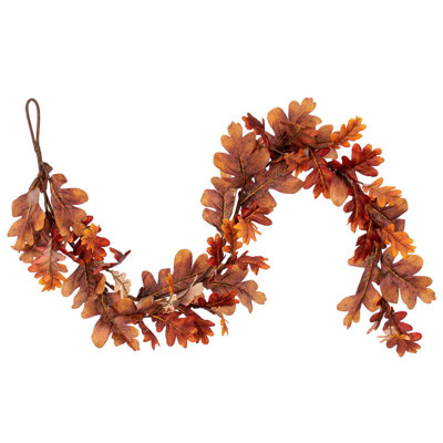 Vickerman 60" Orange Autumn Oak Leaf Garland. It measures 60 by 9 inches.