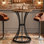 Table de bar 37,4 po de hauteur, table de pub ronde avec base en métal courbé (brun et noir)