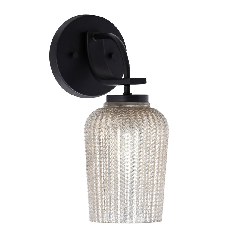 Cavella Wall Sconce Shown In Matte Black Finish With 5" Textured Glass, Clear Seedy
