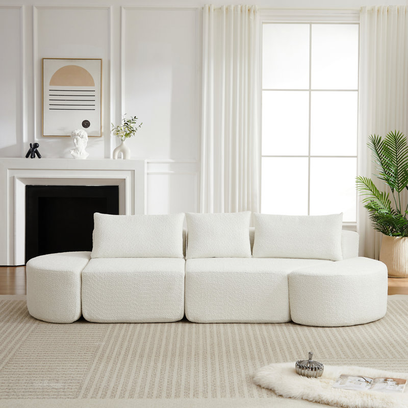 Ensemble de canapé modulaire en forme de V en chenille, comprenant trois coussins décoratifs et deux repose-pieds courbés, idéal pour les salons, les chambres et les bureaux.