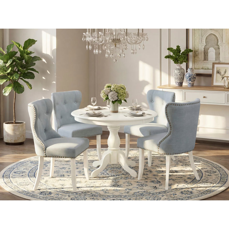 L'ensemble 5 pièces de table et chaises de cuisine comprend une table de salle à manger ronde avec piédestal et 4 chaises Parson en tissu bleu bébé, lin blanc