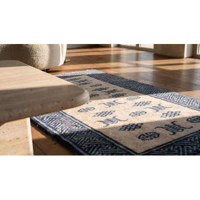 Tapis blanc antique et blanc en laine nouée à la main