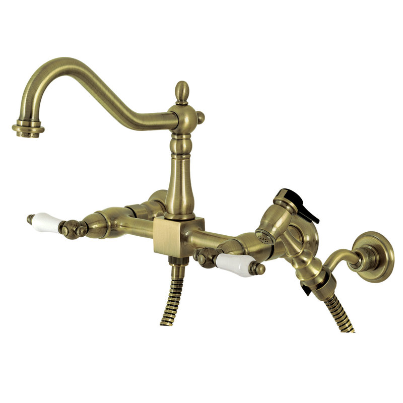 Kingston Brass Heritage Double-Handle 3-Hole Wall-Mount Bridge Kitchen Faucet with Brass Sprayer, Vintage Brass